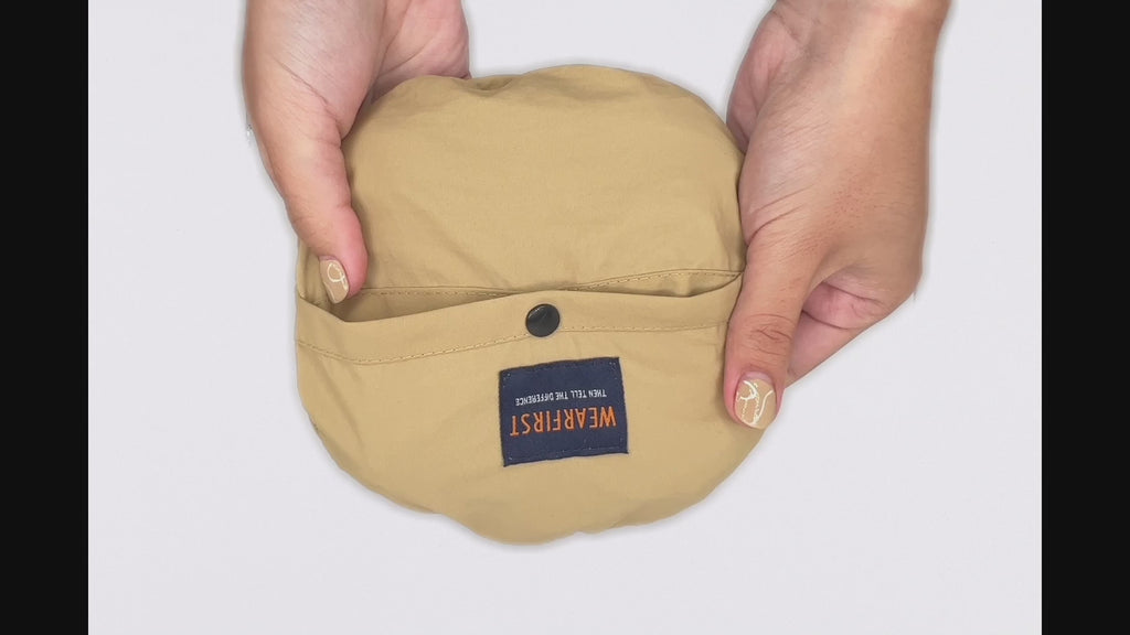 A video demonstration showing us opening and closing the logo packable bucket hat. 