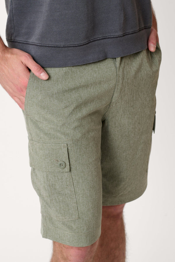 Male model dressed in hiking shorts for men with the WEARFIRST Go-To Short in Army Heather Green 