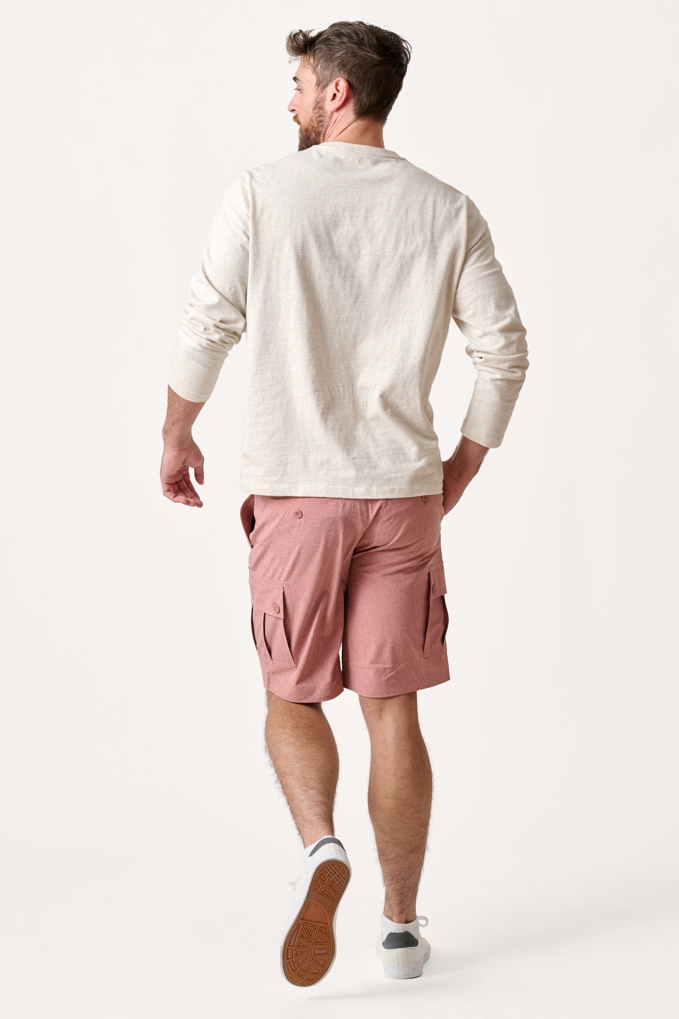 Male model dressed in hiking shorts for men with the WEARFIRST Go-To Short in Canyon Red Heather
