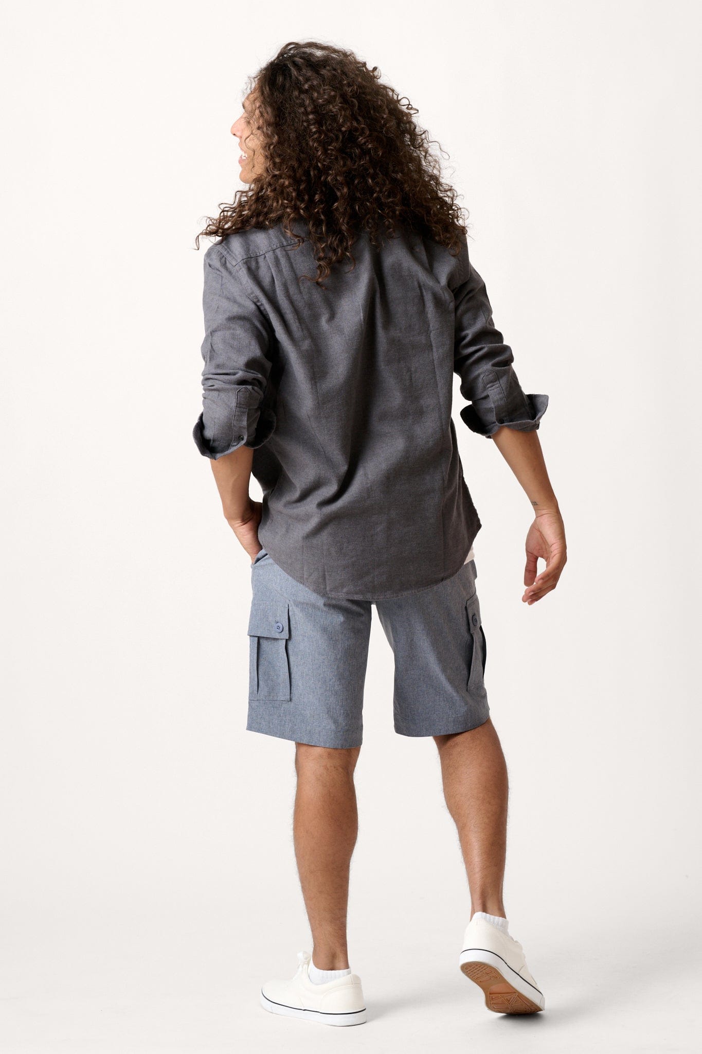 Male model dressed in hiking shorts for men with the WEARFIRST Go-To Short in Navy Heather
