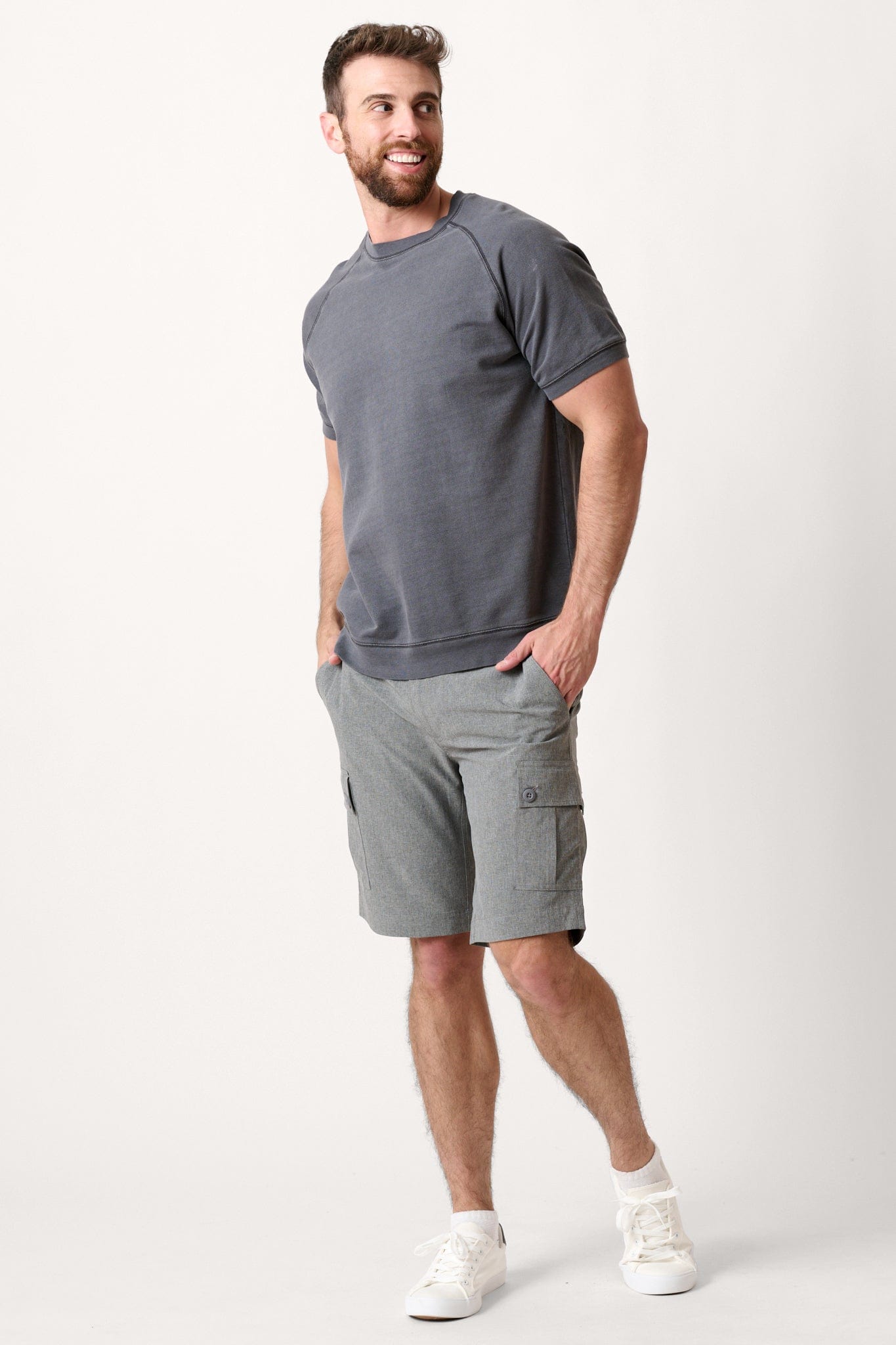 Male model dressed in hiking shorts for men with the WEARFIRST Go-To Short in Tap Shoe Heather