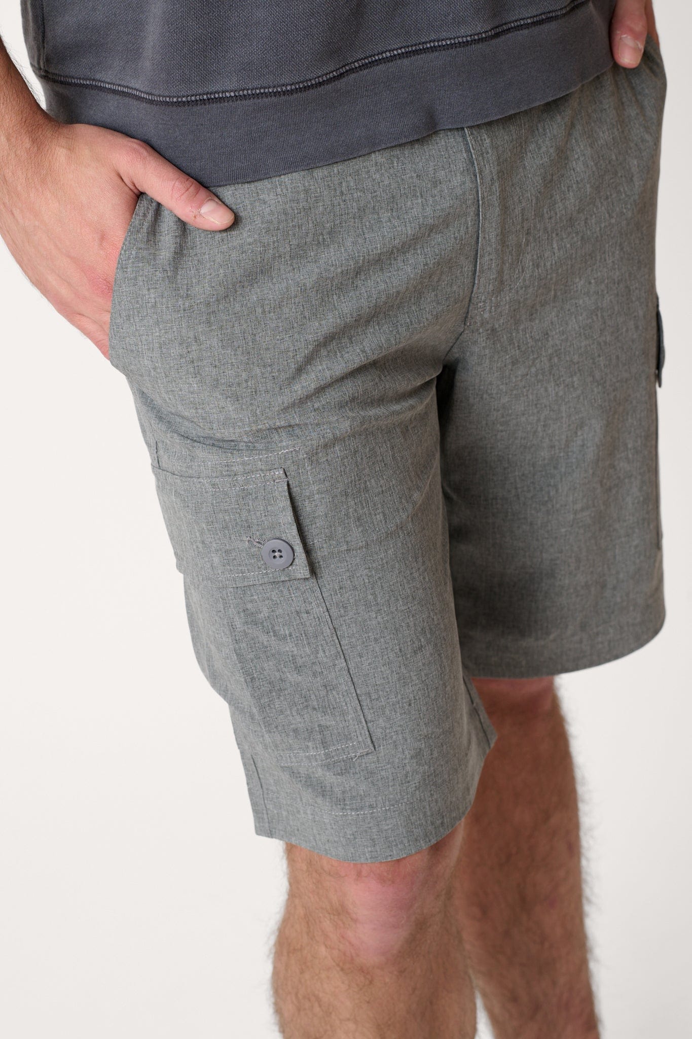 Male model dressed in hiking shorts for men with the WEARFIRST Go-To Short in Tap Shoe Heather