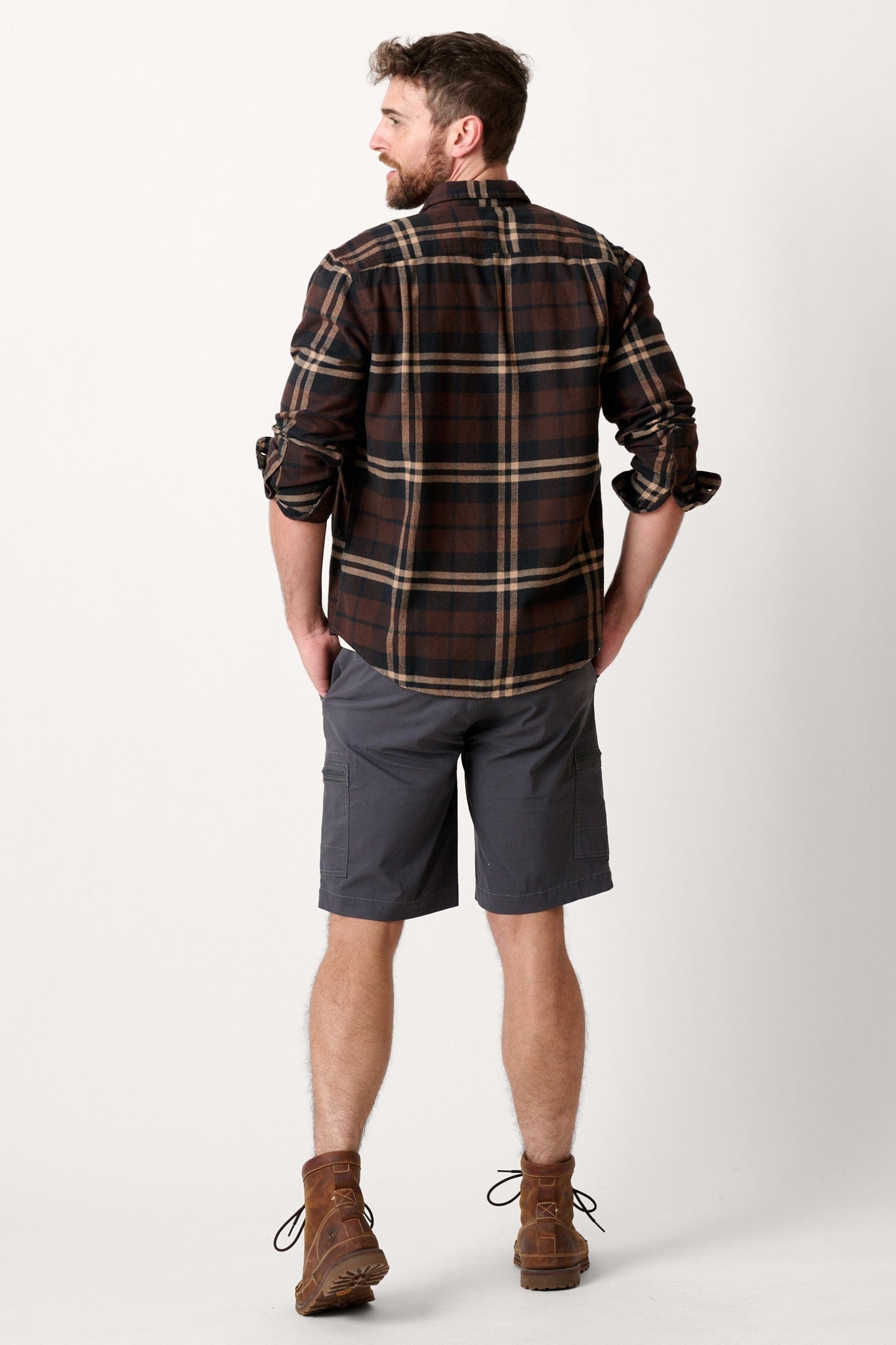 Male model dressed in tailored fit WEARFIRST Switchback Short with in Grey Ebony