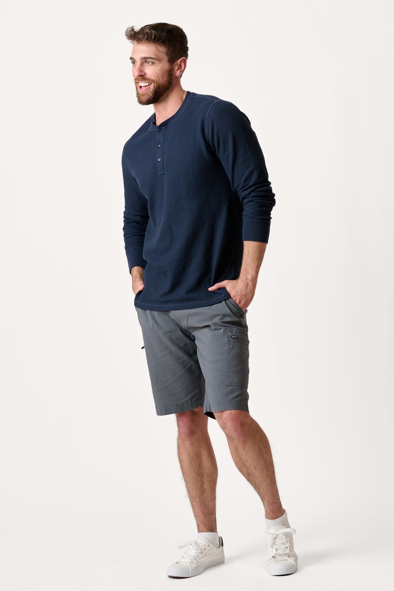 Male model dressed in tailored fit WEARFIRST Switchback Short with in Turbulence