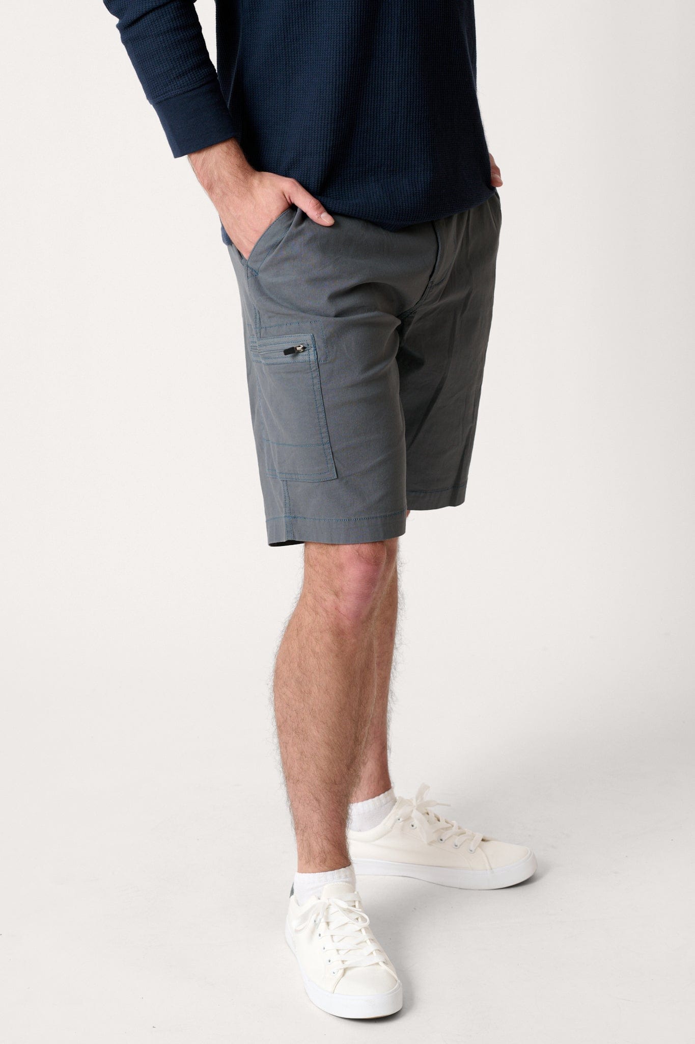 Male model dressed in tailored fit WEARFIRST Switchback Short with in Turbulence