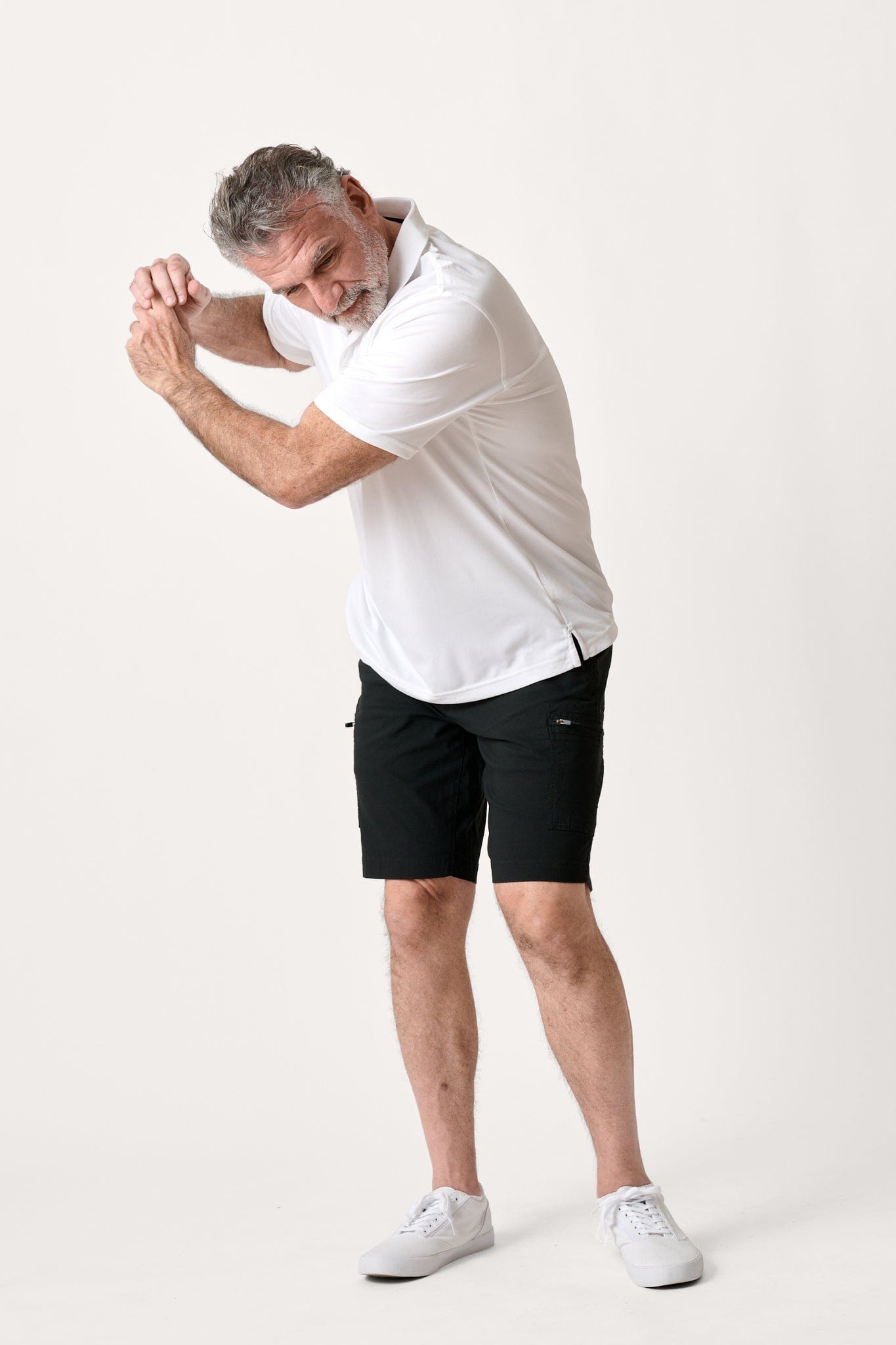 Male model dressed in tailored fit WEARFIRST Switchback Short with in Tap Shoe