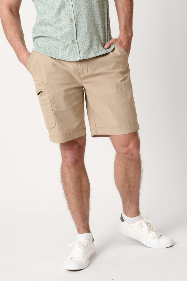Male model dressed in casual men’s style with the WEARFIRST Venture Short in Chinchilla beige