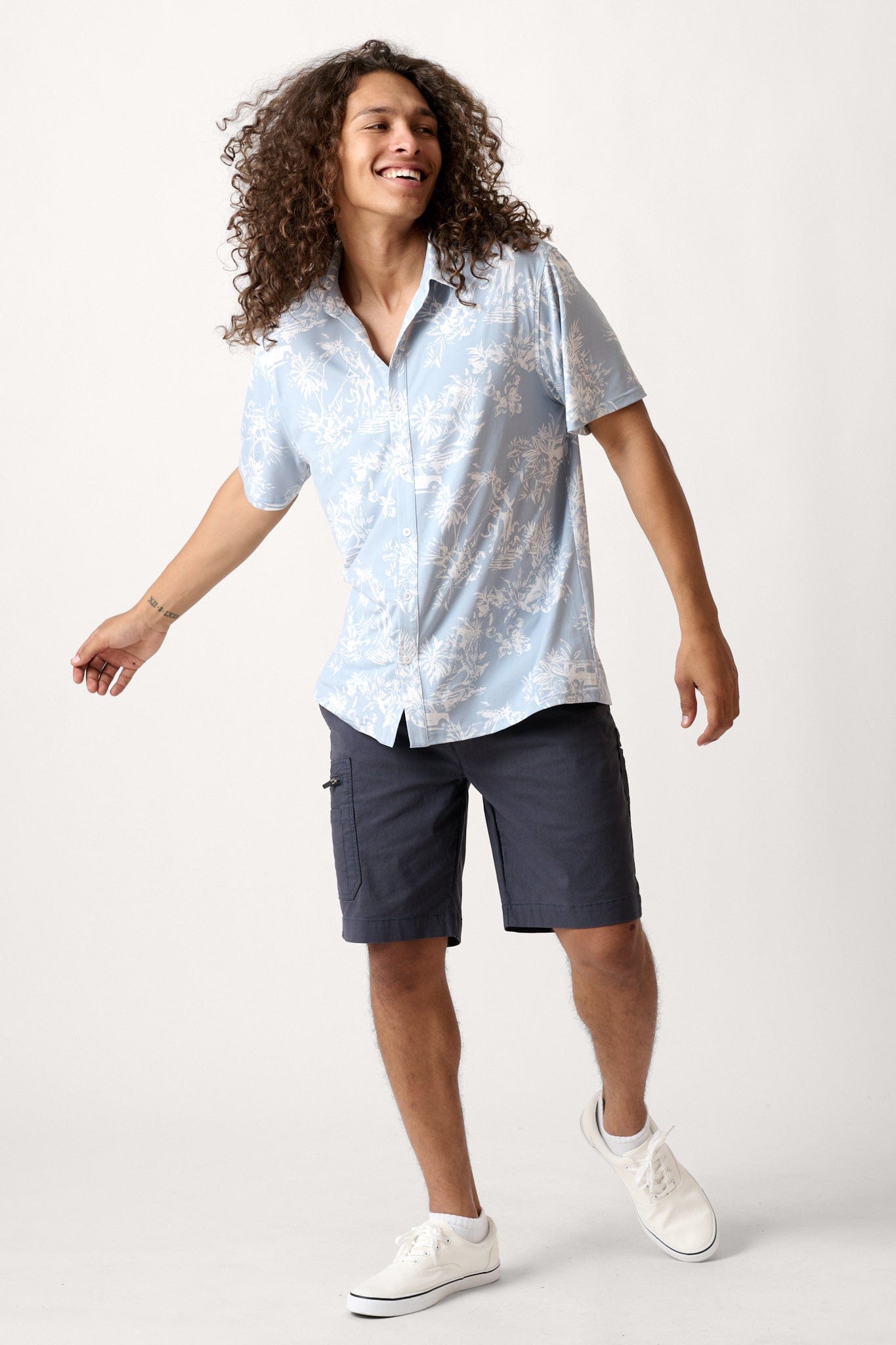 Male model dressed in casual men’s style with the WEARFIRST Venture Short in India Ink Blue