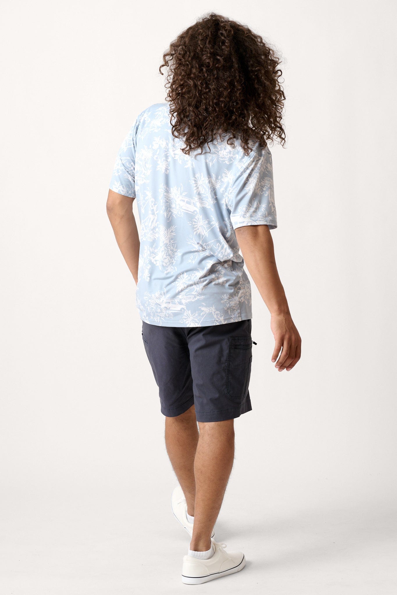 Male model dressed in casual men’s style with the WEARFIRST Venture Short in India Ink Blue