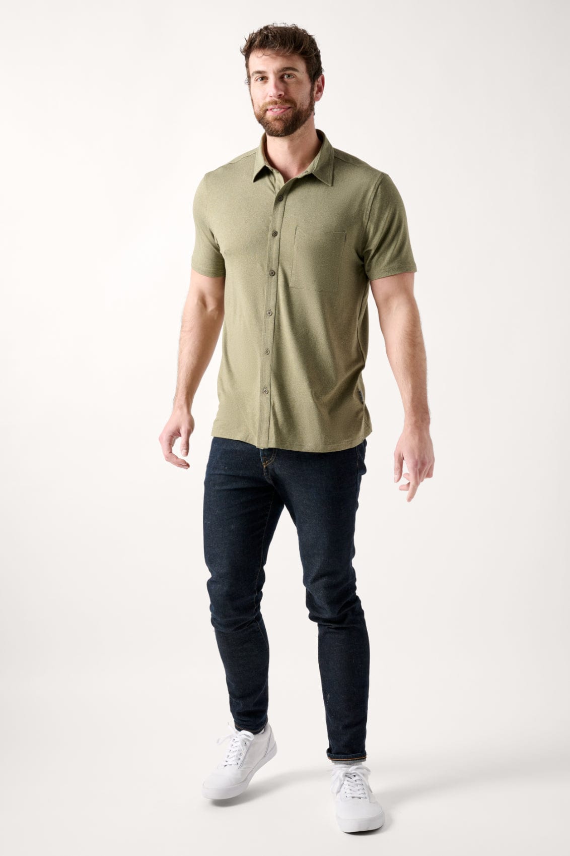 Male dressed in casual style with the All Day Performance Shirt in Four Leaf Clover Heather