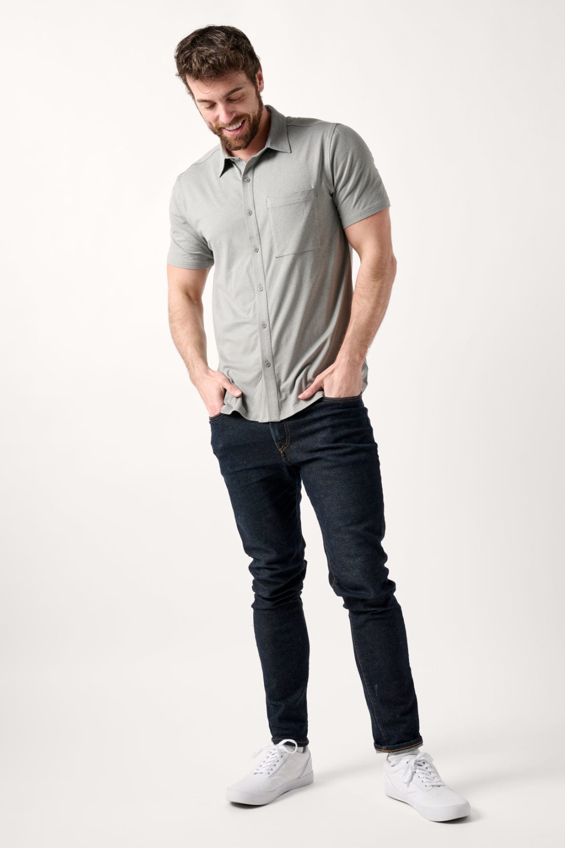 Male model dressed in casual style with the WEARFIRST All Day Performance Shirt in Gray Heather