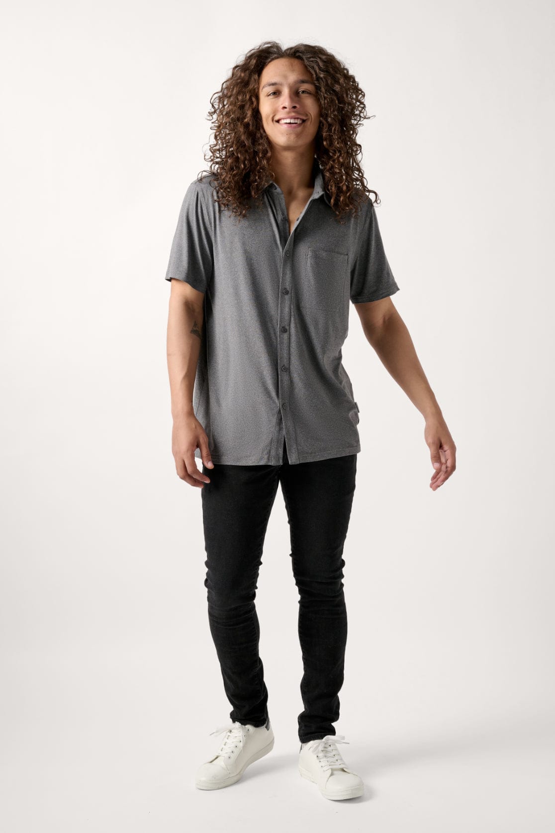Male model dressed in casual style with the WEARFIRST All Day Performance Shirt in Tap Shoe Heather