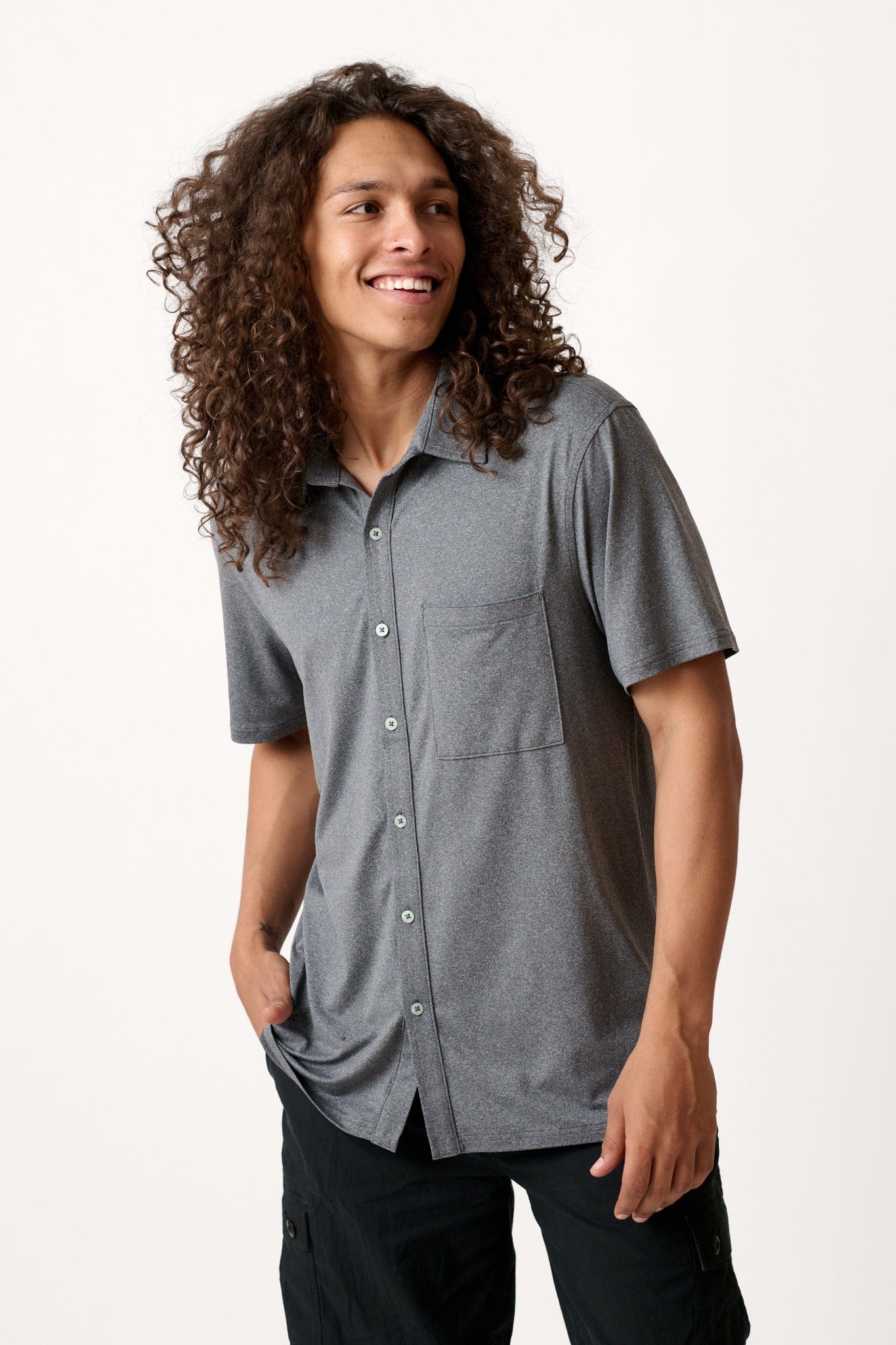 Male model dressed casual with the WEARFIRST All Day Performance Shirt in Tap Shoe Heather