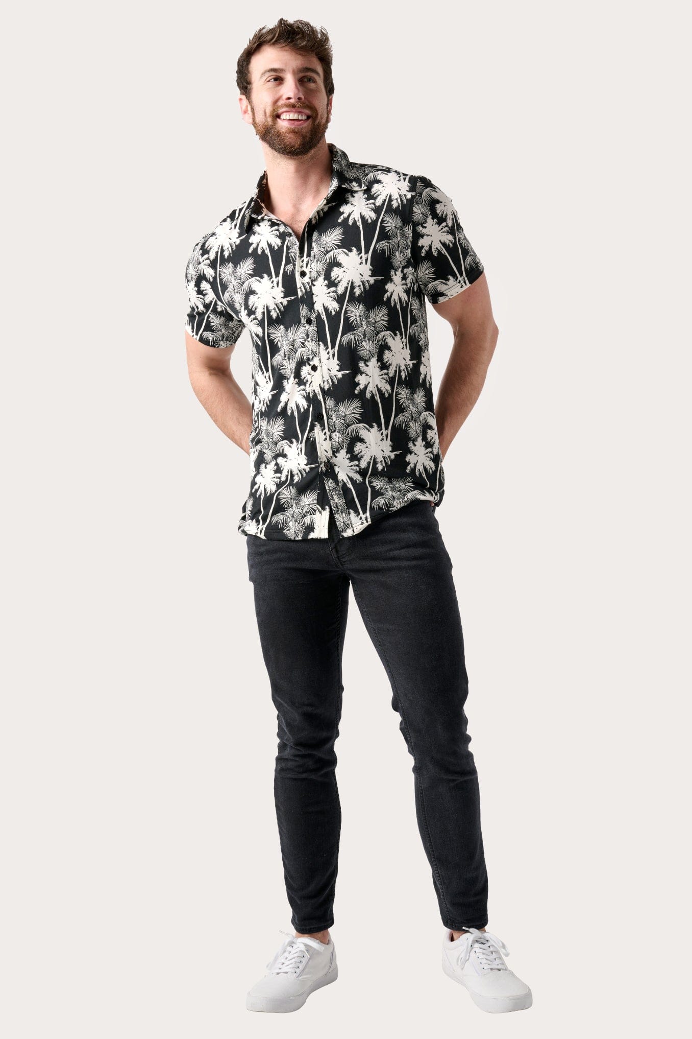 Male model dressed in men’s fitted shirt with the WEARFIRST Wanderer Shirt in Tap Shoe Palms