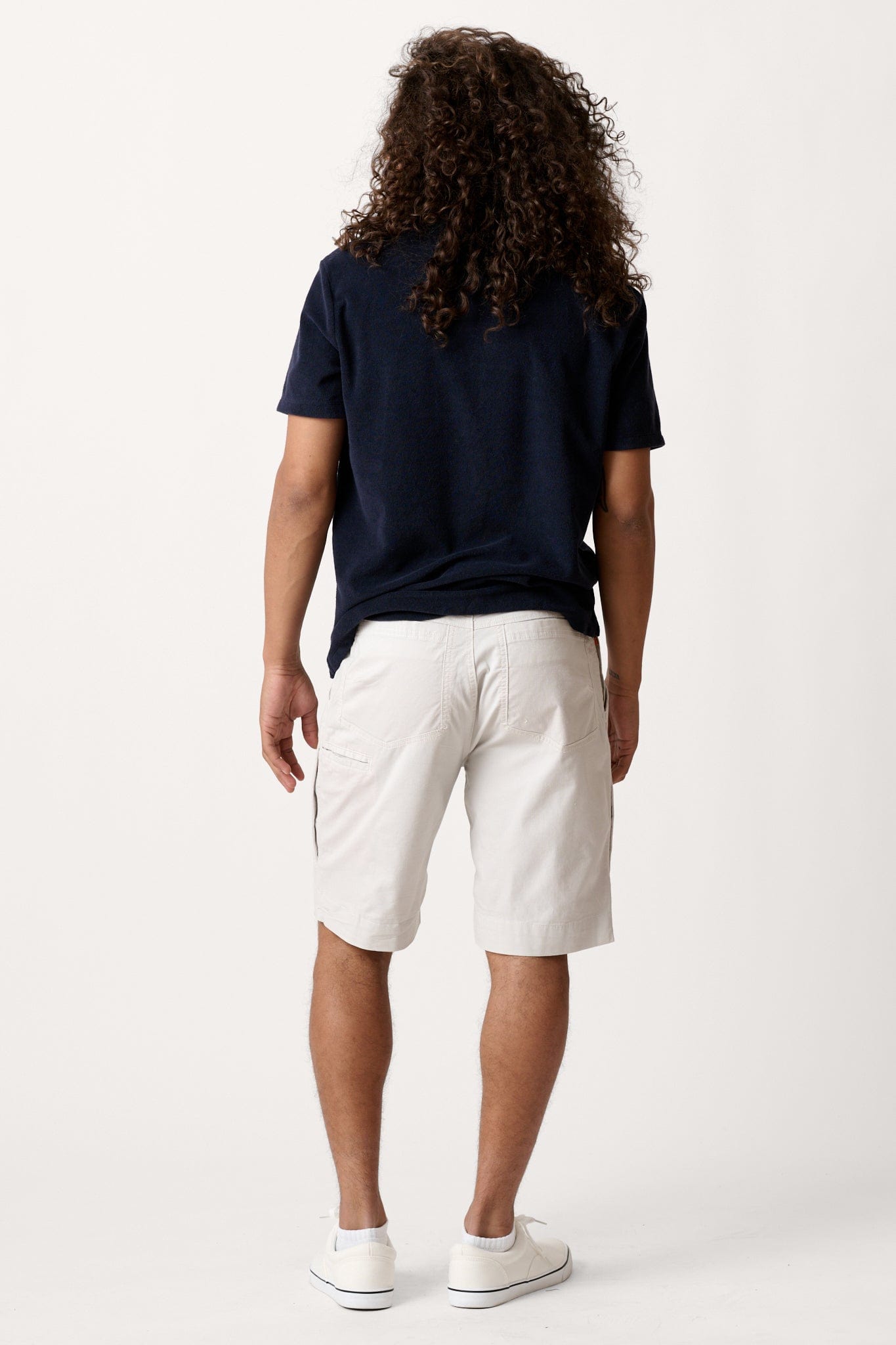 Male model dressed in tailored fit activewear with the WEARFIRST Hudson Cargo Short in Dawn Grey