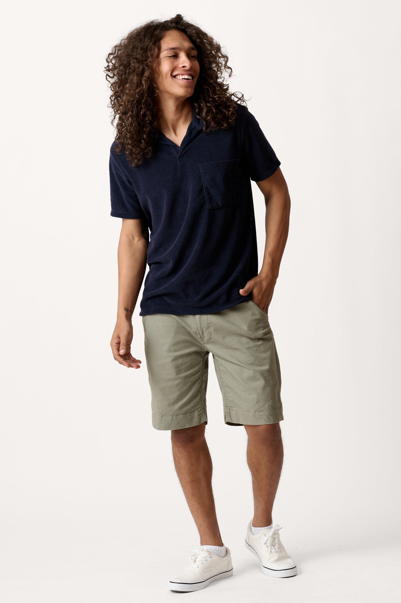 Male model dressed in tailored fit activewear with the WEARFIRST Hudson Cargo Short in Vetiver Green