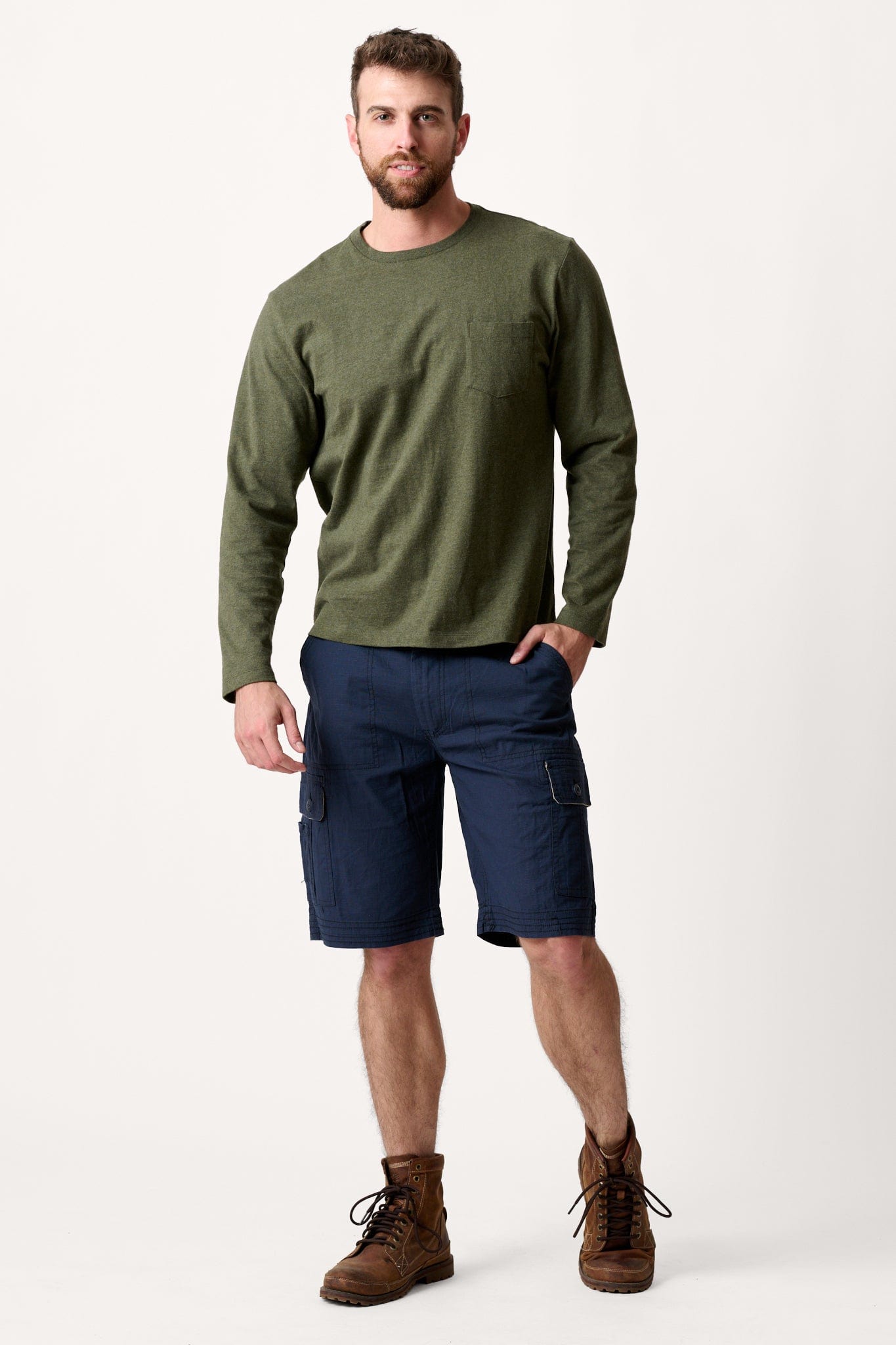 Male model dressed in casual style with the WEARFIRST Tailslide Cargo Short with in Blue Nights