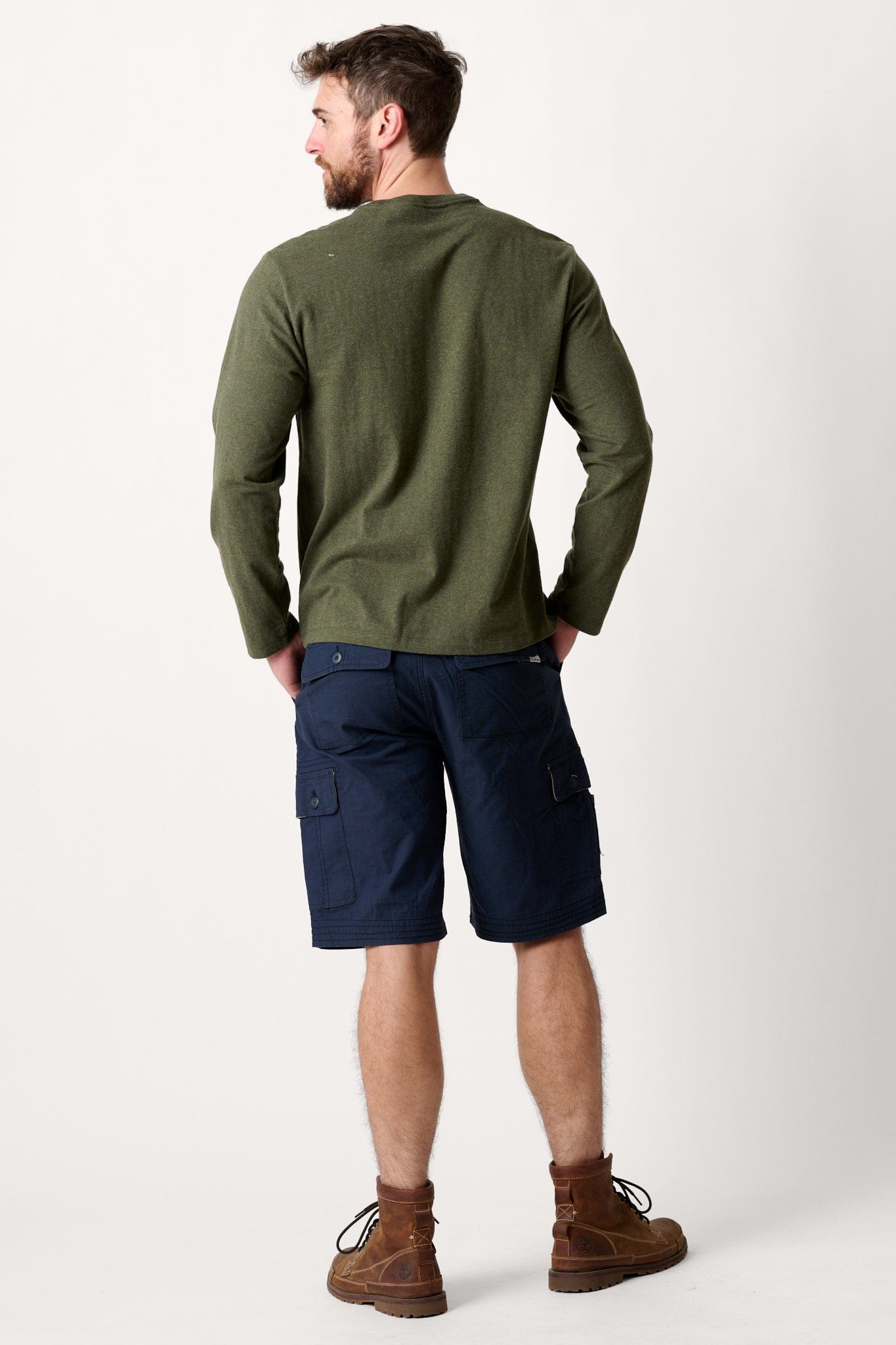 Male model dressed in casual style with the WEARFIRST Tailslide Cargo Short with in Blue Nights