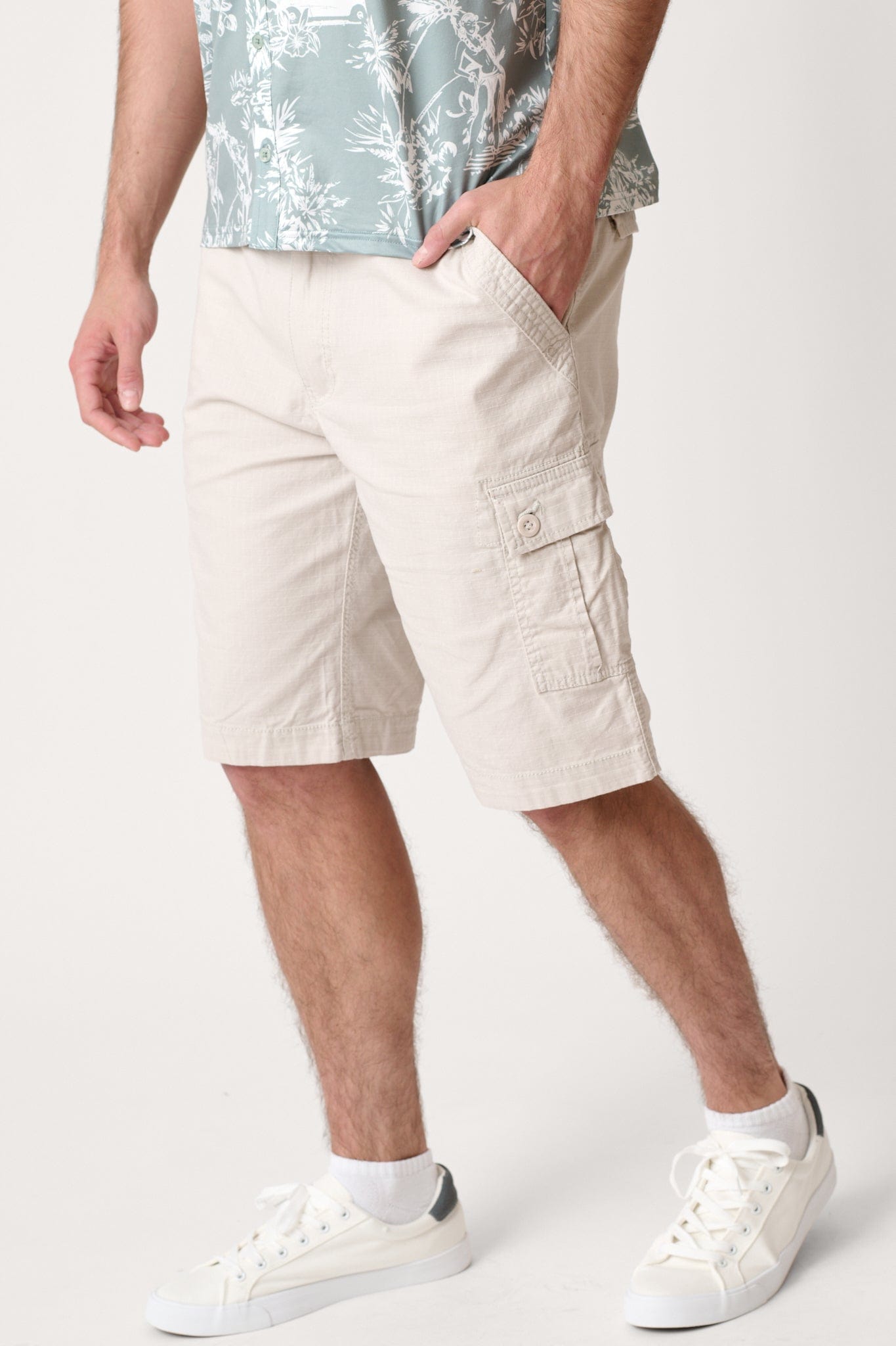 Male model dressed in WEARFIRST Caution Ripstop Day Hiker Cargo Short in Pale Tan