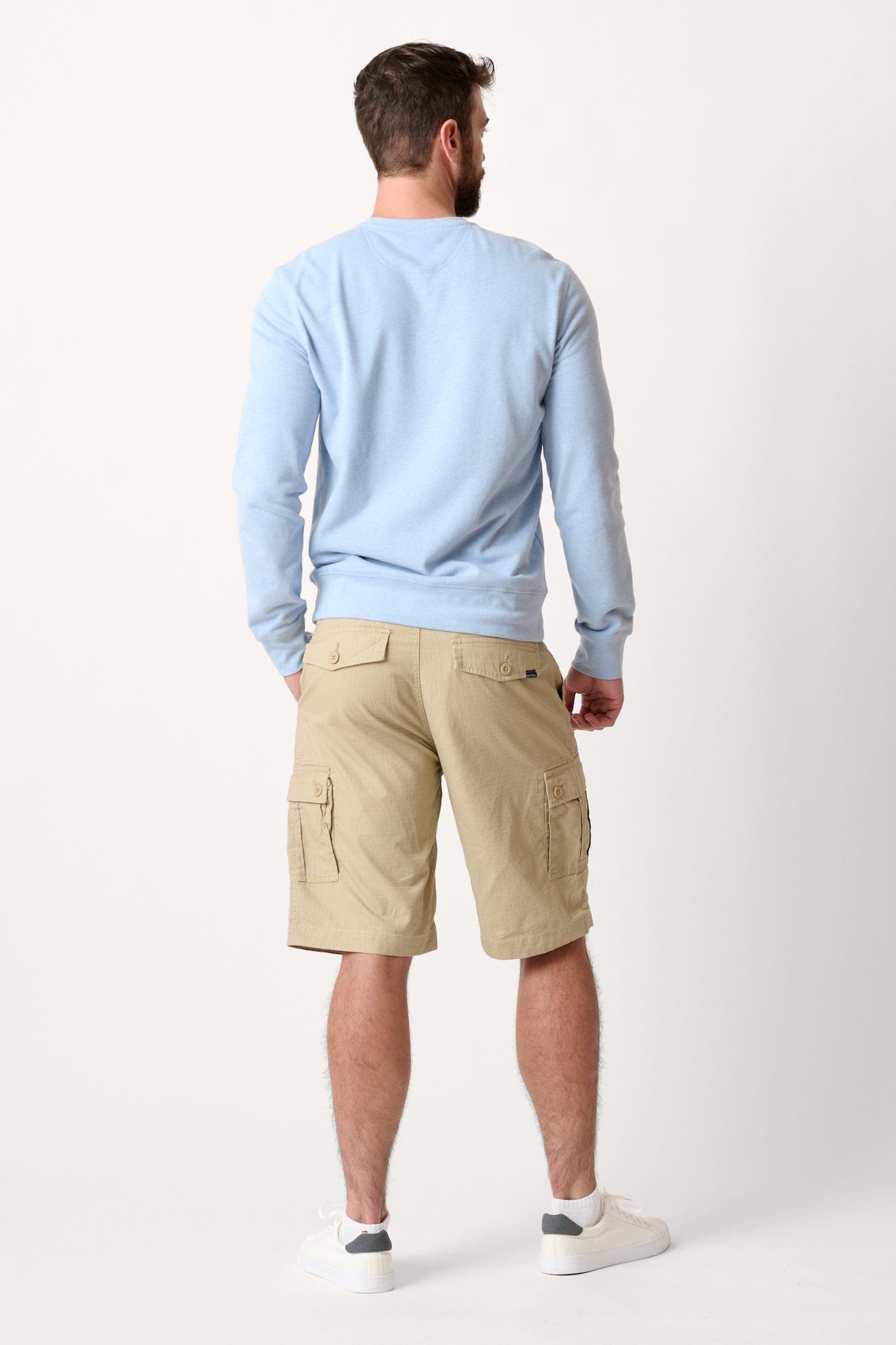 Male model dressed in WEARFIRST Caution Ripstop Day Hiker Cargo Short in Twill