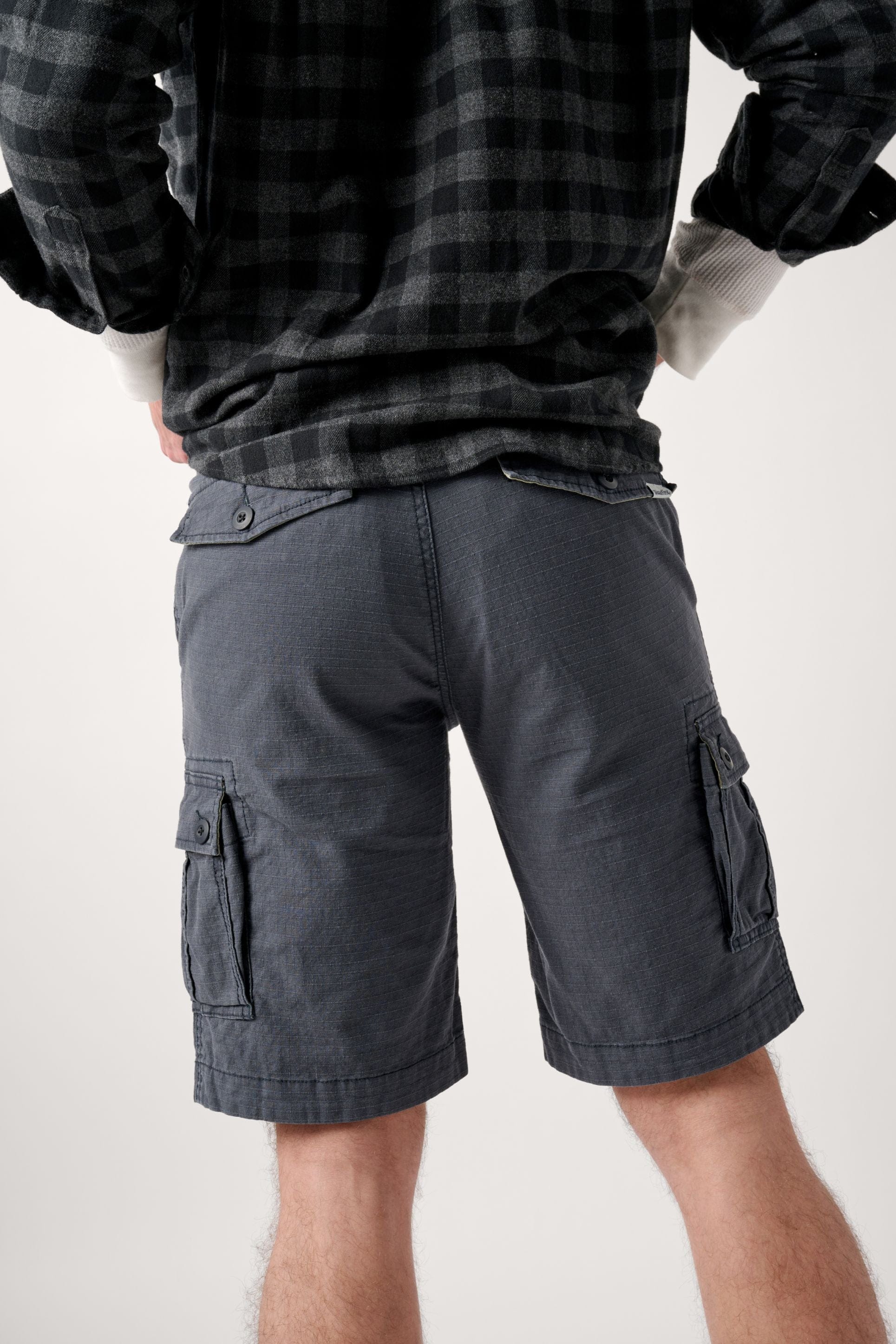 Male model dressed in WEARFIRST Caution Ripstop Day Hiker Cargo Short in India Ink