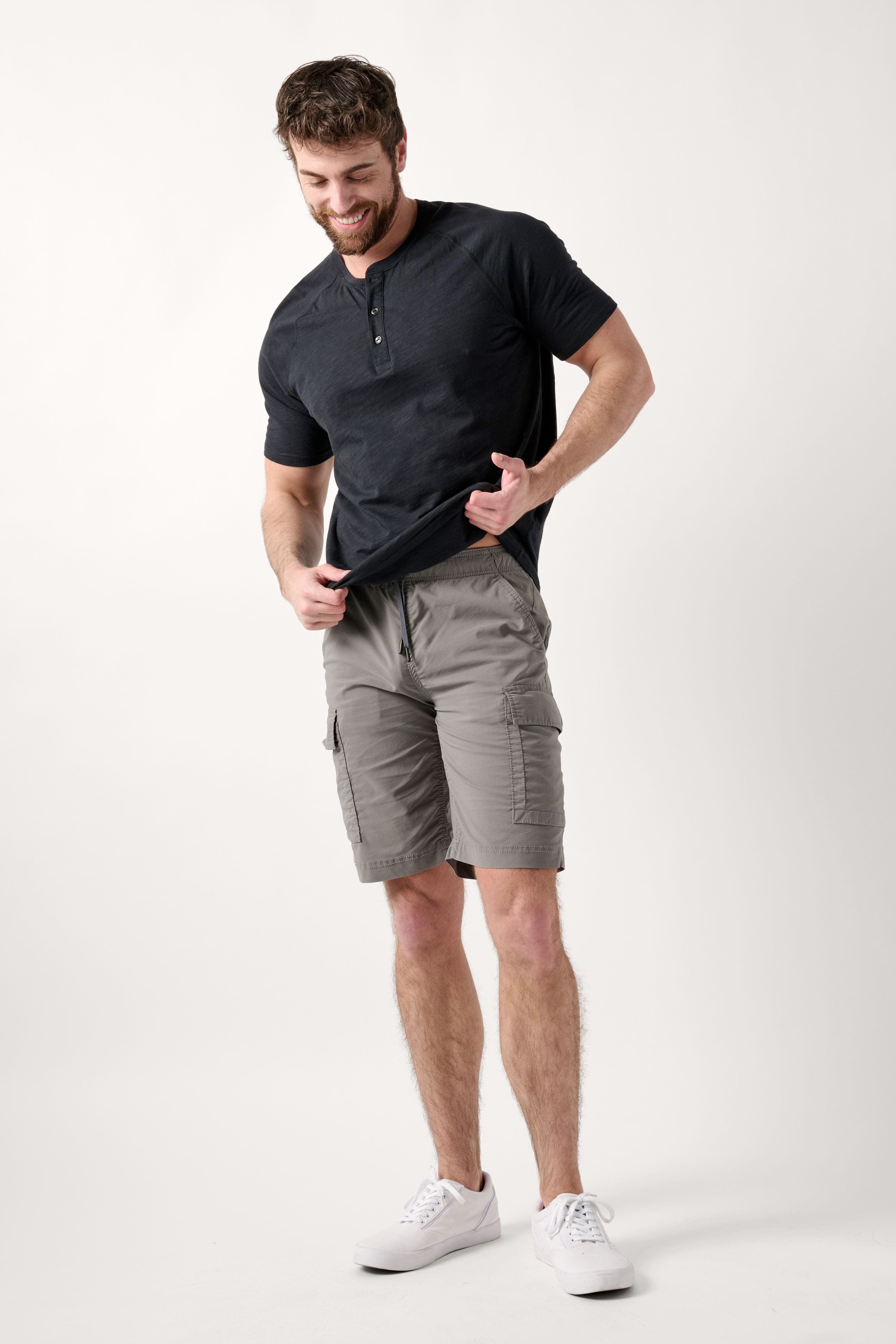 Male model dressed in the WEARFIRST Pacer Cargo Short with a drawstring in Gargoyle