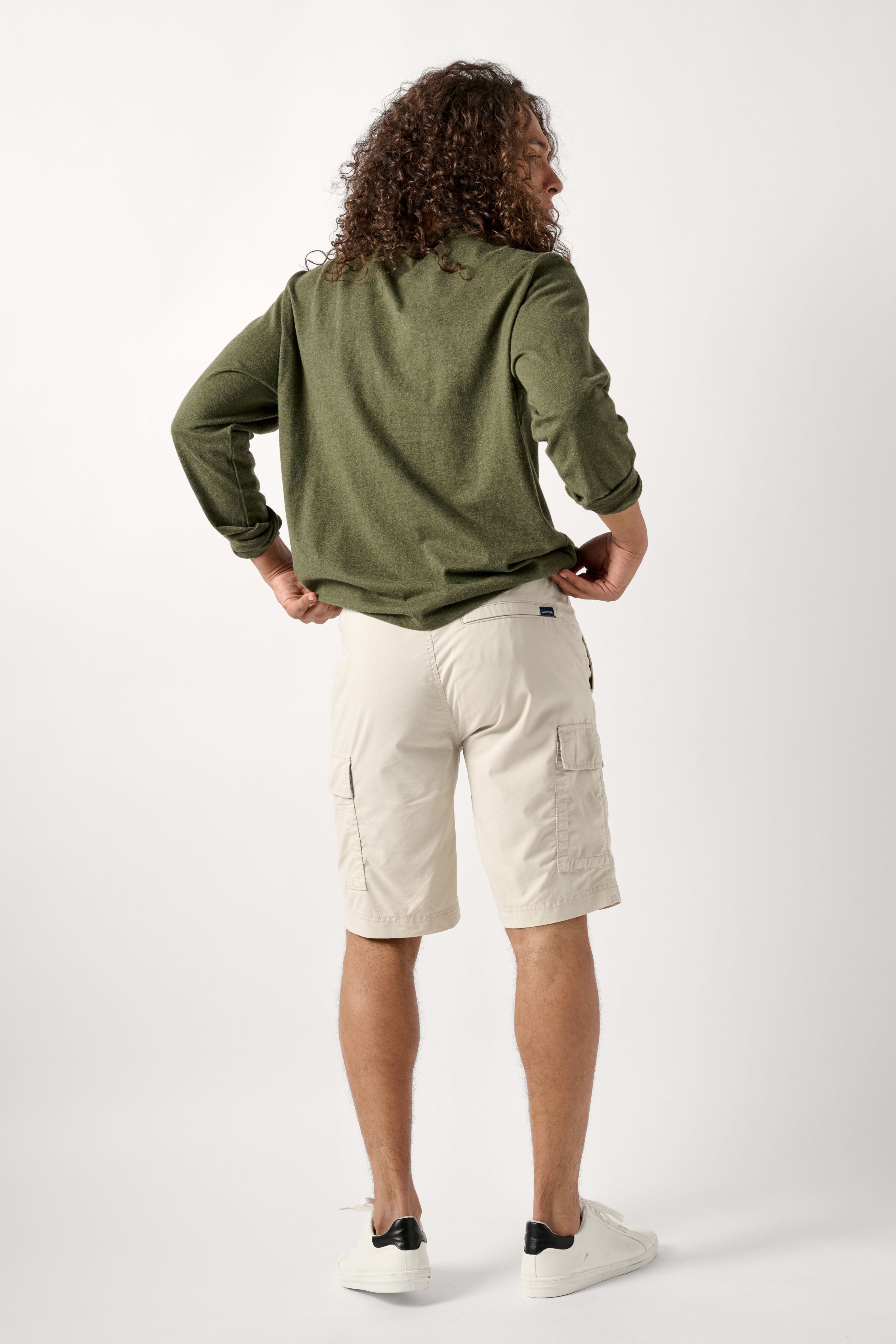 Male model dressed in the WEARFIRST Pacer Cargo Short with a drawstring in Pelican