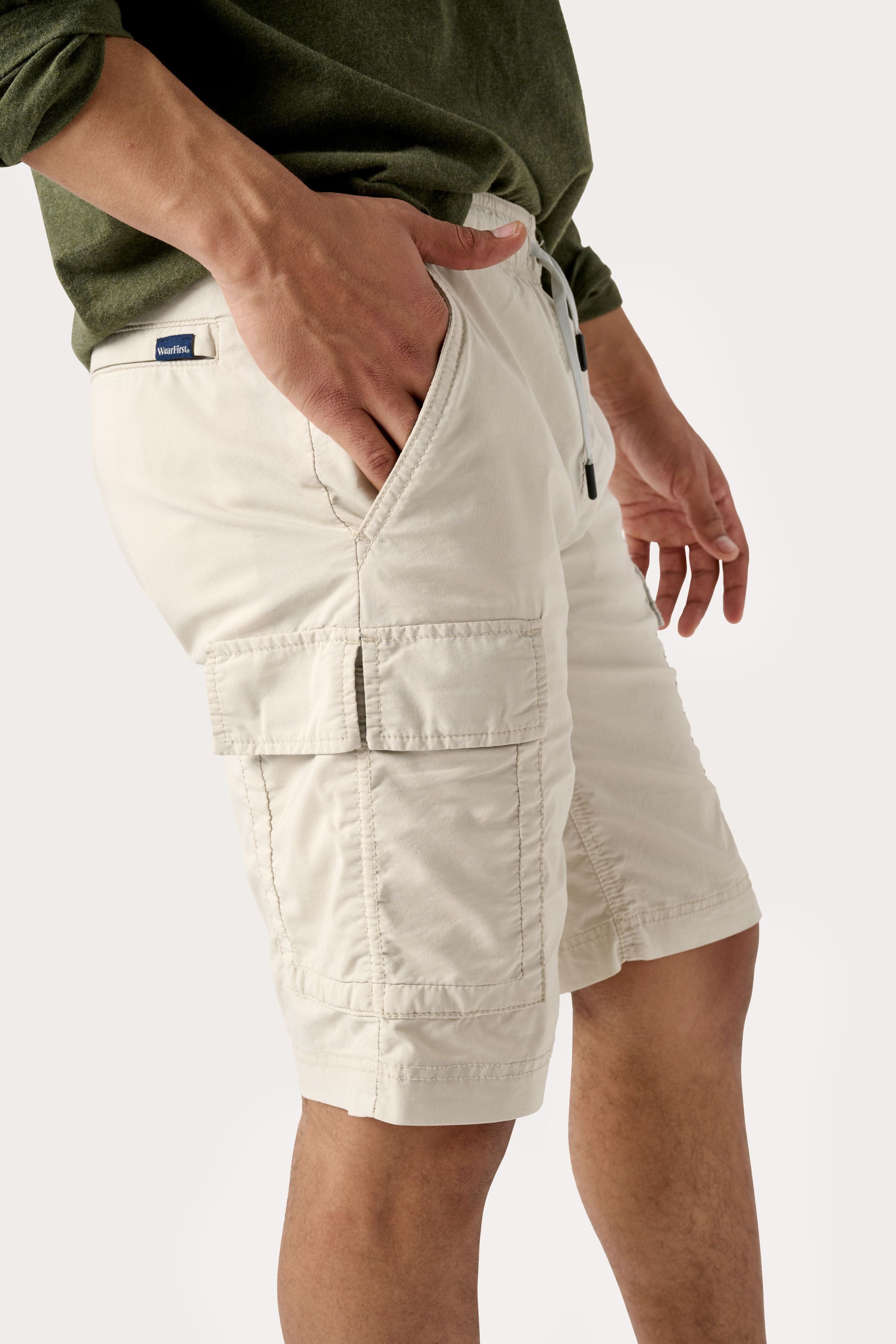 Male model dressed in the WEARFIRST Pacer Cargo Short with a drawstring in Pelican