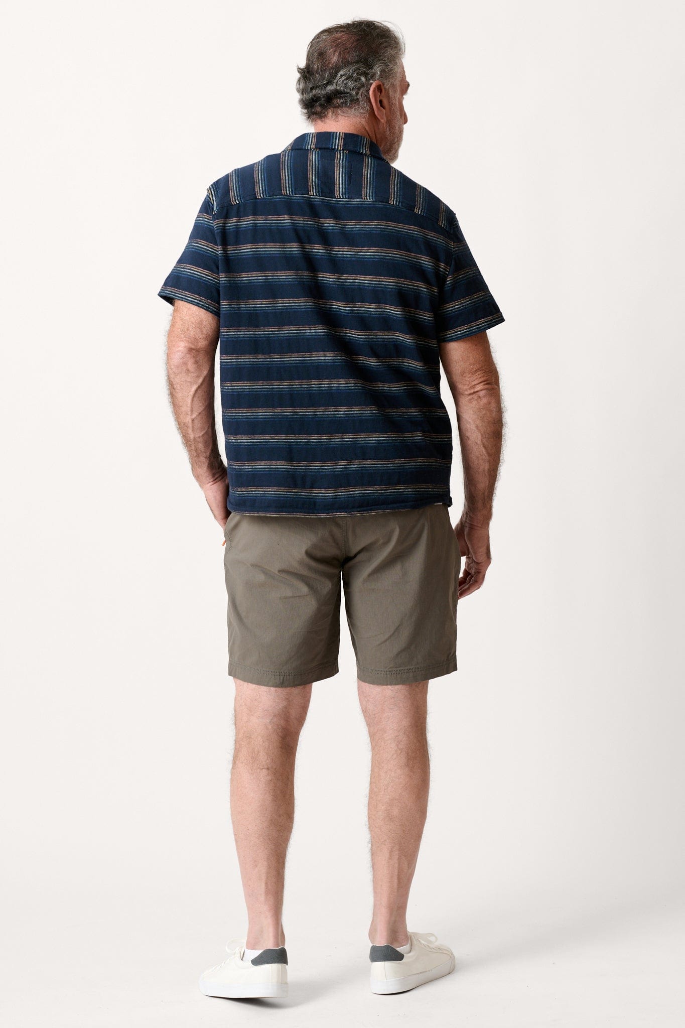 Male model dressed in WEARFIRST Offshore Short with an 8 inch inseam Ultimate Gray