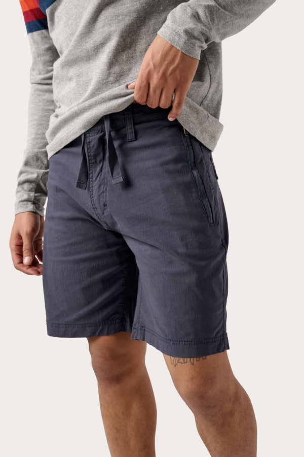 Male model dressed in WEARFIRST Offshore Short with an 8 inch inseam in India Ink.