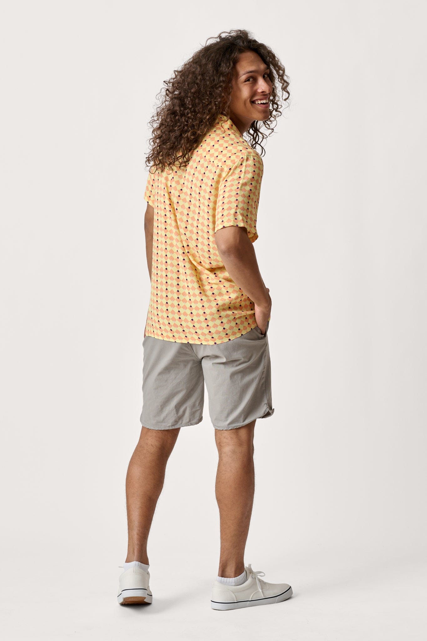 Male model dressed in men’s lightweight shorts with the WEARFIRST Volley Short in Neutral Gray