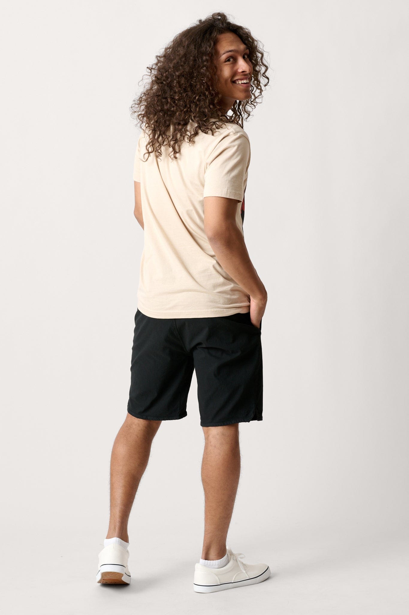 Male model dressed in men’s lightweight shorts with the WEARFIRST Volley Short in Tap Shoe Black 