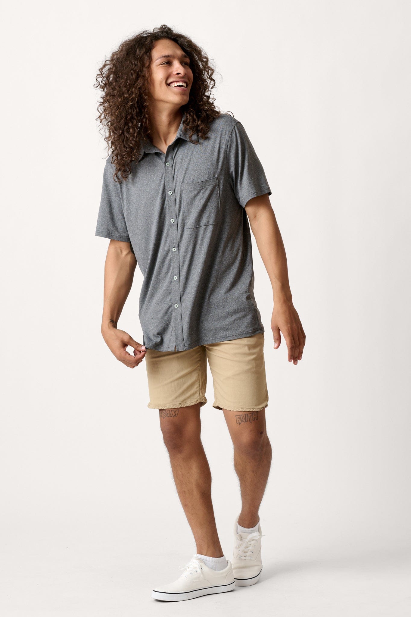 Male model dressed in men’s lightweight shorts with the WEARFIRST Volley Short in Twill Beige