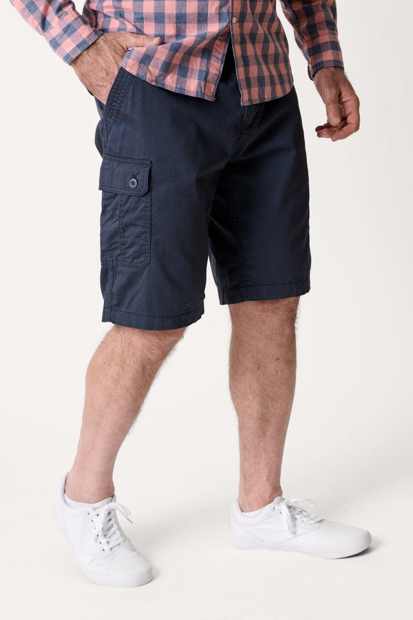Male model dressed in casual men’s style with the WEARFIRST Stretch Texture Short in Blue Nights