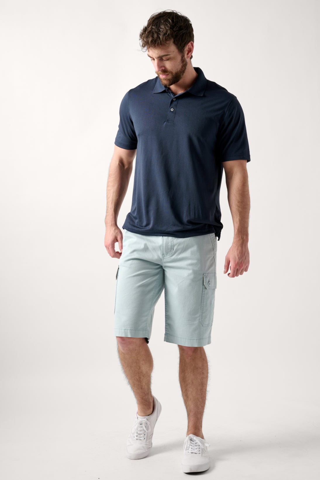Male model dressed in casual men’s style with the WEARFIRST Stretch Texture Short in Sterling Blue