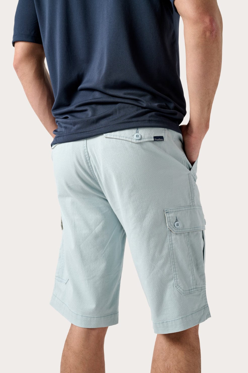 Male model dressed in casual men’s style with the WEARFIRST Stretch Texture Short in Sterling Blue