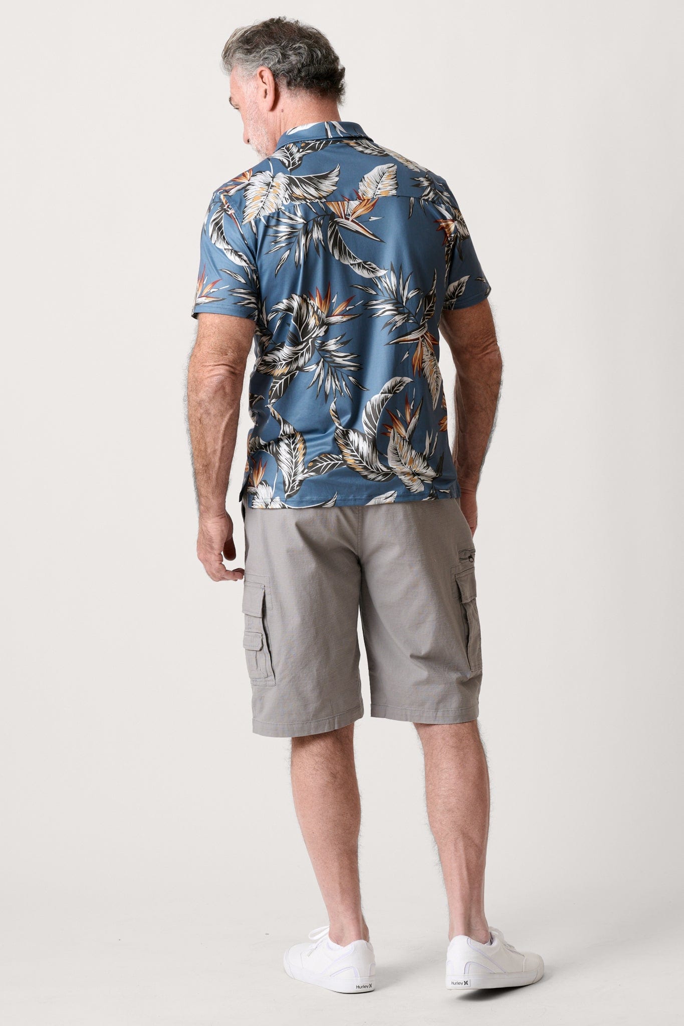 Male model dressed in men’s ripstop cargo shorts with the WEARFIRST Stretch Cargo Short in gray