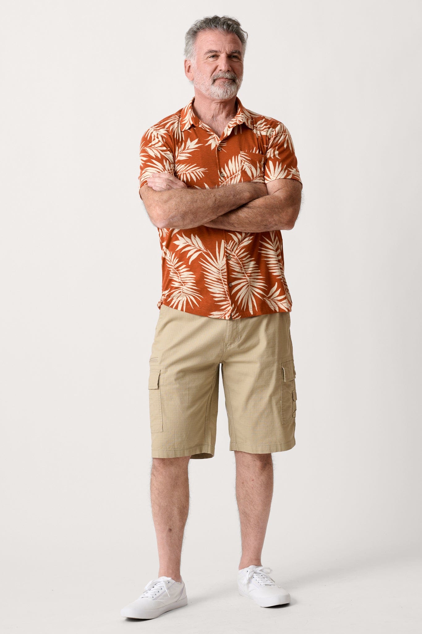 Male model dressed in men’s ripstop cargo shorts with the WEARFIRST Stretch Cargo Short in Khaki