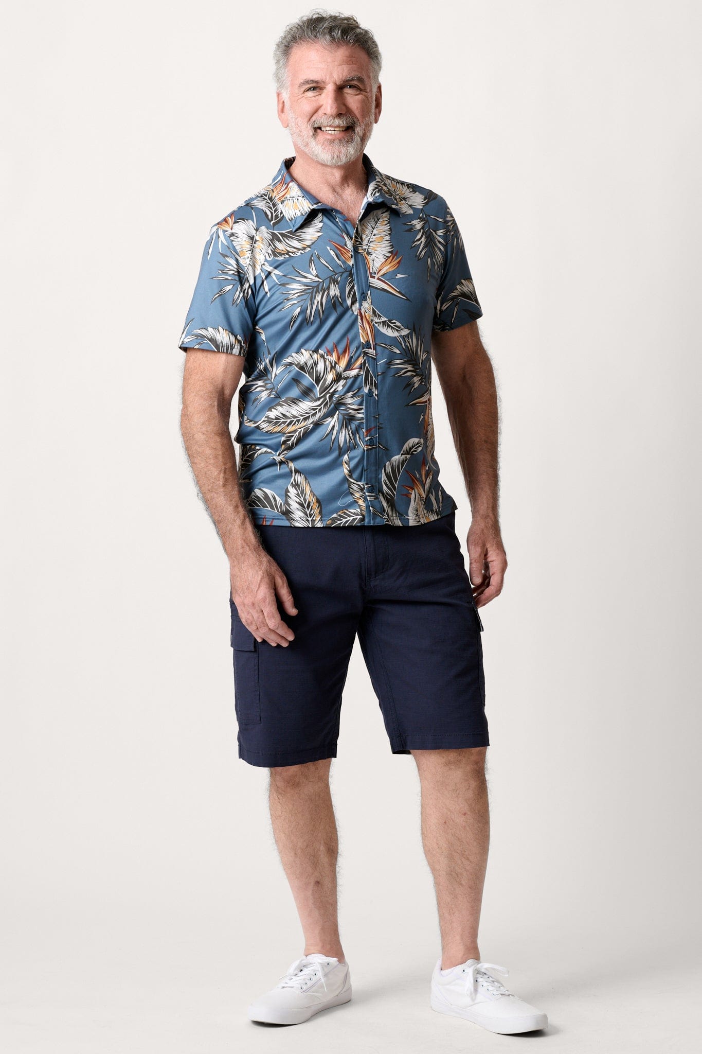 Male model dressed in men’s ripstop cargo shorts with the WEARFIRST Stretch Cargo Short in Navy